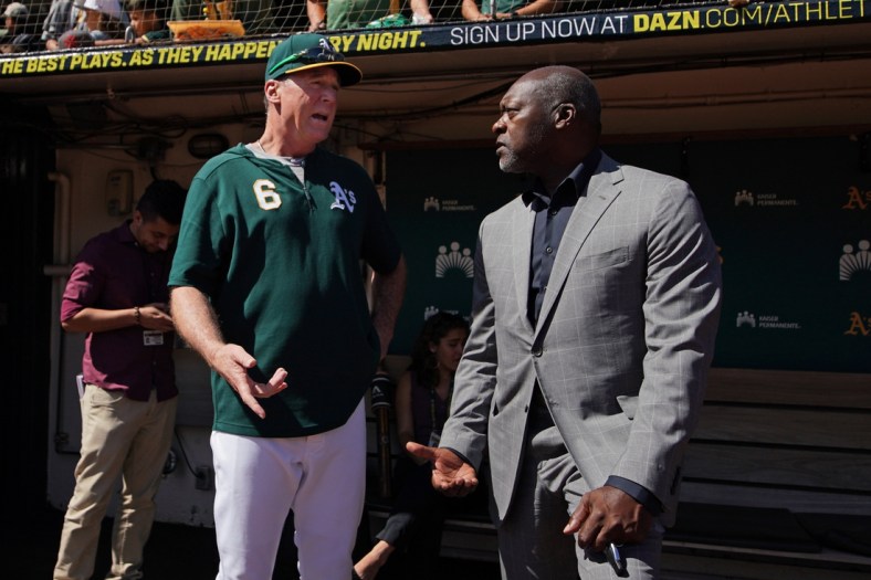 Sep 8, 2019; Oakland, CA, USA; Oakland Athletics manager Bob Melvin (6) talks to former pitcher Dave Stewart before the game against the Detroit Tigers at Oakland Coliseum. Mandatory Credit: Darren Yamashita-USA TODAY Sports