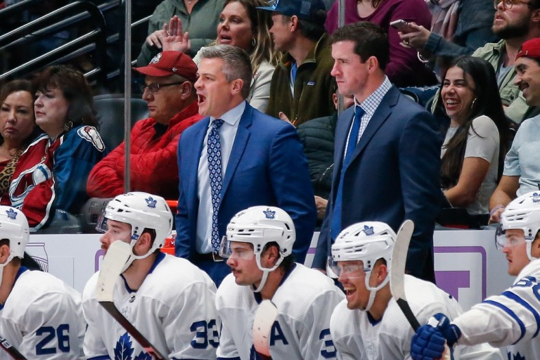 Nov 23, 2019; Denver, CO, USA; Toronto Maple Leafs head coach Sheldon Keefe (L) and assistant coach Paul McFarland (R) in the third period against the Colorado Avalanche at the Pepsi Center. Mandatory Credit: Isaiah J. Downing-USA TODAY Sports