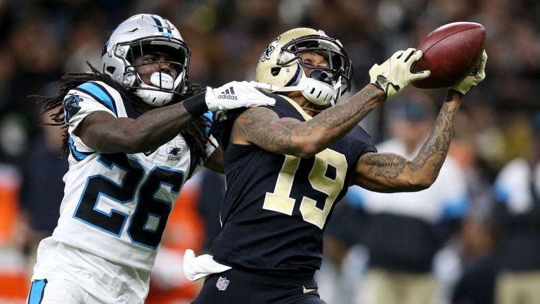 Nov 24, 2019; New Orleans, LA, USA; New Orleans Saints wide receiver Ted Ginn (19) attempts to make a catch with Carolina Panthers cornerback Donte Jackson (26) defending in the second half at the Mercedes-Benz Superdome. The Saints won, 34-31. Mandatory Credit: Chuck Cook-USA TODAY Sports