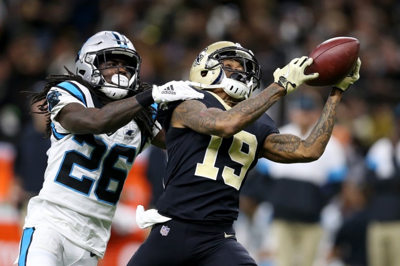 Nov 24, 2019; New Orleans, LA, USA; New Orleans Saints wide receiver Ted Ginn (19) attempts to make a catch with Carolina Panthers cornerback Donte Jackson (26) defending in the second half at the Mercedes-Benz Superdome. The Saints won, 34-31. Mandatory Credit: Chuck Cook-USA TODAY Sports