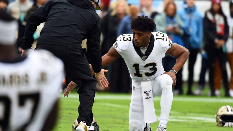 Dec 22, 2019; Nashville, Tennessee, USA; New Orleans Saints wide receiver Michael Thomas (13) and New Orleans Saints head coach Sean Payton slap hands before the game against the Tennessee Titans at Nissan Stadium. Mandatory Credit: Christopher Hanewinckel-USA TODAY Sports