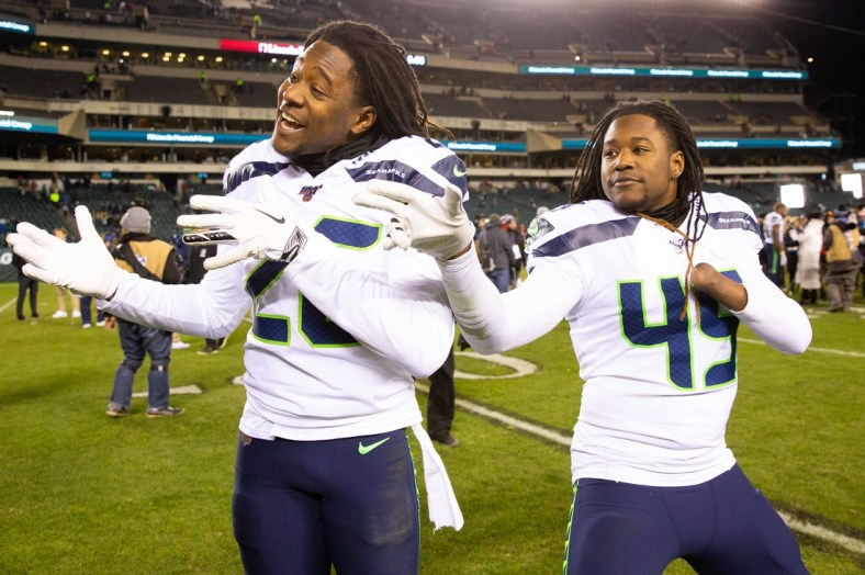 Jan 5, 2020; Philadelphia, Pennsylvania, USA; Seattle Seahawks cornerback Shaquill Griffin (26) and outside linebacker Shaquem Griffin (49) celebrate a victory against the Philadelphia Eagles in a NFC Wild Card playoff football game at Lincoln Financial Field. Mandatory Credit: Bill Streicher-USA TODAY Sports