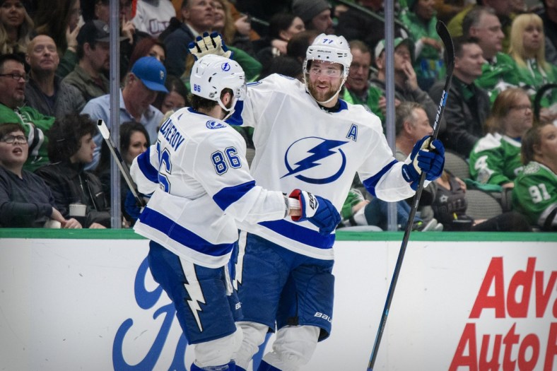 Jan 27, 2020; Dallas, Texas, USA; Tampa Bay Lightning right wing Nikita Kucherov (86) and defenseman Victor Hedman (77) celebrate a goal during the game between the Stars and the Lightning at the American Airlines Center. Mandatory Credit: Jerome Miron-USA TODAY Sports