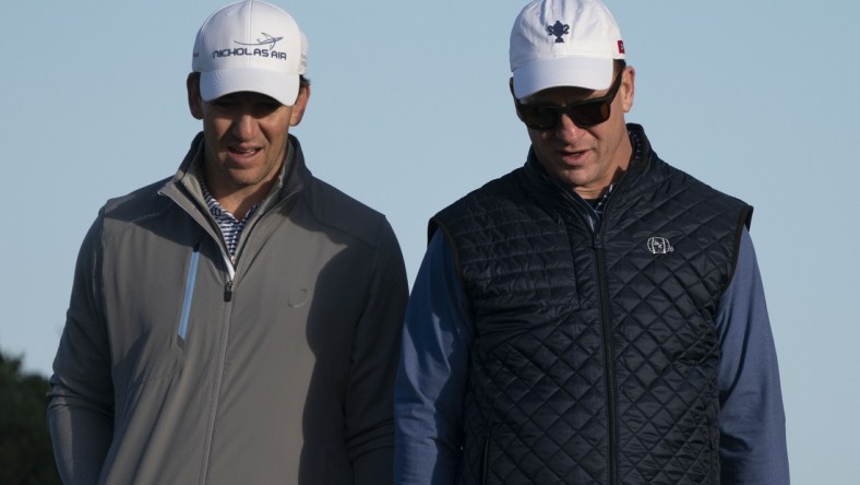 February 7, 2020; Pebble Beach, California, USA; Eli Manning (left) and Peyton Manning (right) walk on the 11th hole during the second round of the AT&T Pebble Beach Pro-Am golf tournament at Monterey Peninsula Country Club - Shore Course. Mandatory Credit: Kyle Terada-USA TODAY Sports