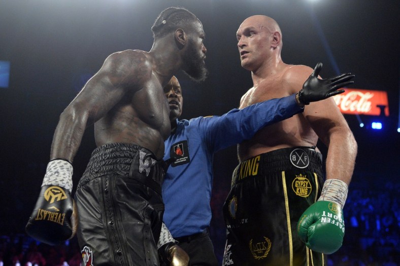 Feb 22, 2020; Las Vegas, Nevada, USA; Deontay Wilder and Tyson Fury stare at one another during their WBC heavyweight title bout at MGM Grand Garden Arena. Fury won via seventh round TKO. Mandatory Credit: Joe Camporeale-USA TODAY Sports