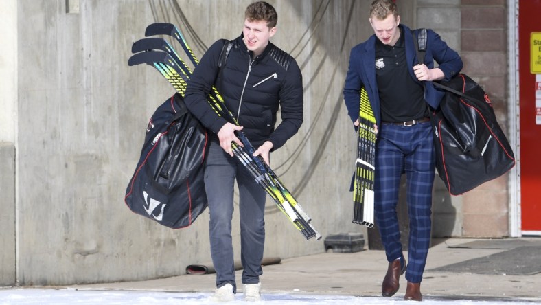 Mar 15, 2020; Calgary, AB, Canada; Calgary Hitmen forward Josh Prokop (10) and defensemen Luke Prokop (6) depart from the Scotiabank Saddledome. The Western Hockey League (WHL) season has been paused due to the COVID-19 coronavirus outbreak.  Mandatory Credit: Candice Ward-USA TODAY Sports