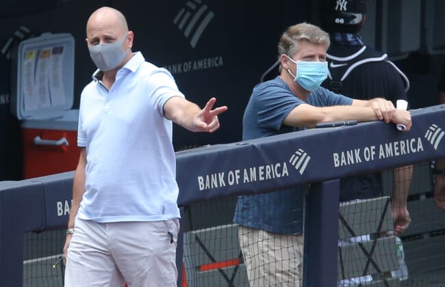 Jul 16, 2020; Bronx, New York, United States; New York Yankees general manager Brian Cashman (left) and owner Hal Steinbrenner watch live batting practice during summer camp workouts at Yankee Stadium. Mandatory Credit: Brad Penner-USA TODAY Sports