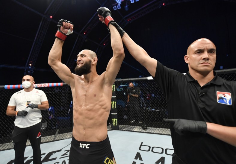 July 26, 2020; Abu Dhabi, UAE; Khamzat Chimaev (red gloves) of Czechia celebrates after his TKO victory over Rhys McKee (not pictured) of Northern Ireland in their welterweight fight during the UFC Fight Night event inside Flash Forum on UFC Fight Island .  Mandatory Credit: Jeff Bottari/Zuffa LLC via USA TODAY Sports