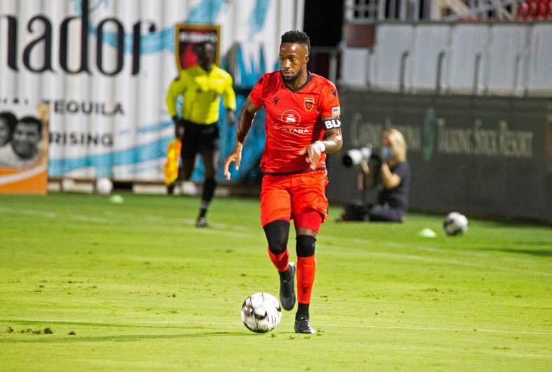 August 8, 2020; Tempe AZ, USA; Forward Junior Flemmings dribbles down the sideline unchallenged. Flemmings enters halftime with one goal against New Mexico United. Mandatory Credit: Justin Toumberlin/The Arizona Republic via USA TODAY NETWORK

Phoenix Rising Fc Faces Off Against New Mexico United