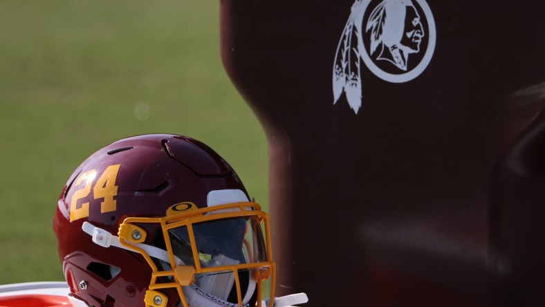 Aug 20, 2020; Ashburn, Virginia, USA; The helmet of Washington Football Team running back Antonio Gibson (not pictured) rests on a cooler next to a trashcan with the retired Washington Redskins logo on day twenty-three of training camp at Inova Sports Performance Center in Ashburn, Virginia. Mandatory Credit: Geoff Burke-USA TODAY Sports