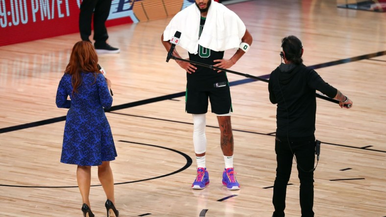 Sep 25, 2020; Lake Buena Vista, Florida, USA; Boston Celtics forward Jayson Tatum (0) is interviewed by sideline reporter Rachel Nichols following game five of the Eastern Conference Finals of the 2020 NBA Playoffs at AdventHealth Arena. Mandatory Credit: Kim Klement-USA TODAY Sports