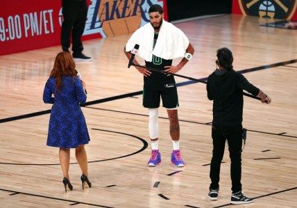 Sep 25, 2020; Lake Buena Vista, Florida, USA; Boston Celtics forward Jayson Tatum (0) is interviewed by sideline reporter Rachel Nichols following game five of the Eastern Conference Finals of the 2020 NBA Playoffs at AdventHealth Arena. Mandatory Credit: Kim Klement-USA TODAY Sports