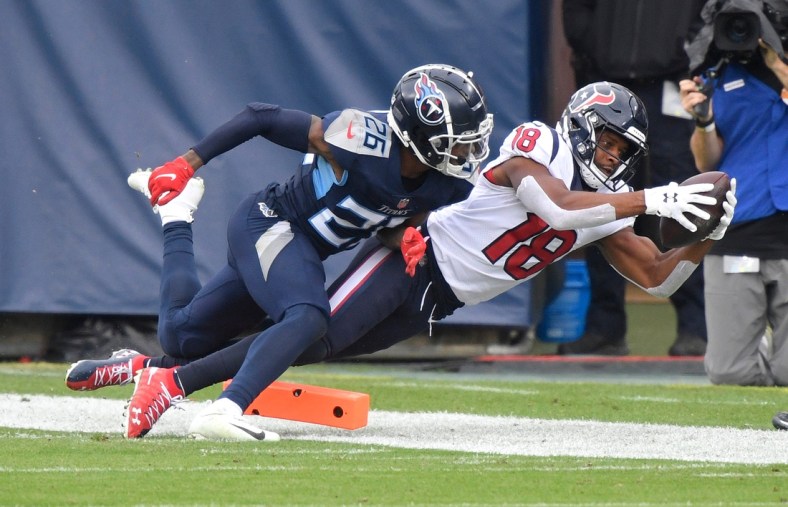 Houston Texans wide receiver Randall Cobb (18) makes a touchdown catch defended by Tennessee Titans cornerback Kristian Fulton (26) during the third quarter at Nissan Stadium Sunday, Oct. 18, 2020 in Nashville, Tenn.

An53718