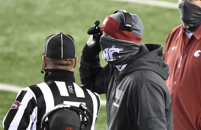 Nov 14, 2020; Pullman, Washington, USA;Washington State Cougars head coach Nick Rolovich talks with an official during a game against the Oregon Ducks in the first half at Martin Stadium. Mandatory Credit: James Snook-USA TODAY Sports