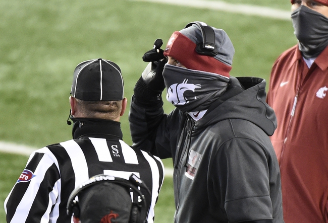 Nov 14, 2020; Pullman, Washington, USA;Washington State Cougars head coach Nick Rolovich talks with an official during a game against the Oregon Ducks in the first half at Martin Stadium. Mandatory Credit: James Snook-USA TODAY Sports