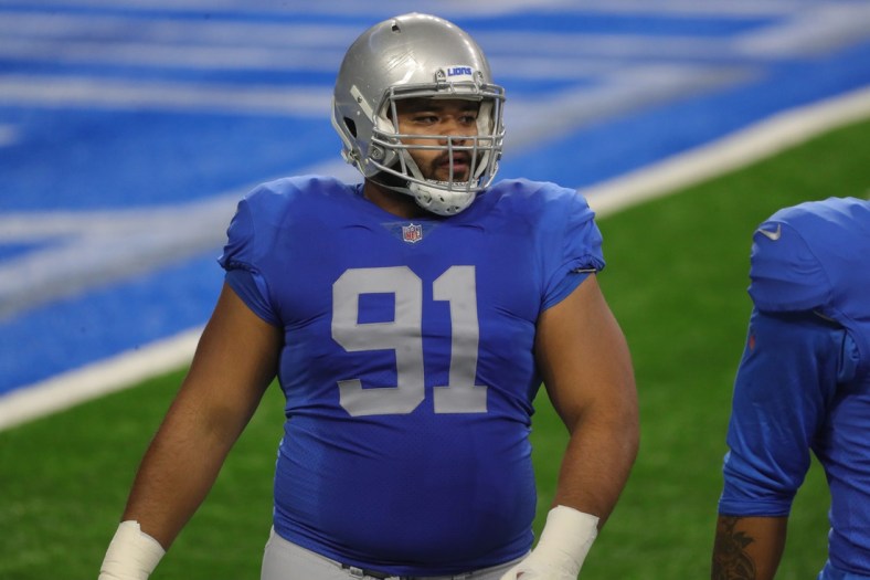 Lions defensive tackle John Penisini warms up before the game against the Houston Texans at Ford Field on Thursday, Nov. 26, 2020.

Lions