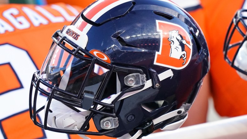 Dec 19, 2020; Denver, Colorado, USA; A general view of the Denver Broncos helmet on sidelines against the Buffalo Bills during the second quarter at Empower Field at Mile High. Mandatory Credit: Troy Babbitt-USA TODAY Sports