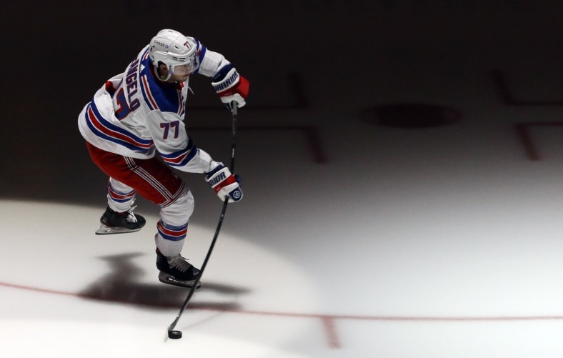 Jan 22, 2021; Pittsburgh, Pennsylvania, USA;  New York Rangers defenseman Tony DeAngelo (77) takes the ice to warm up against the Pittsburgh Penguins at the PPG Paints Arena. Mandatory Credit: Charles LeClaire-USA TODAY Sports