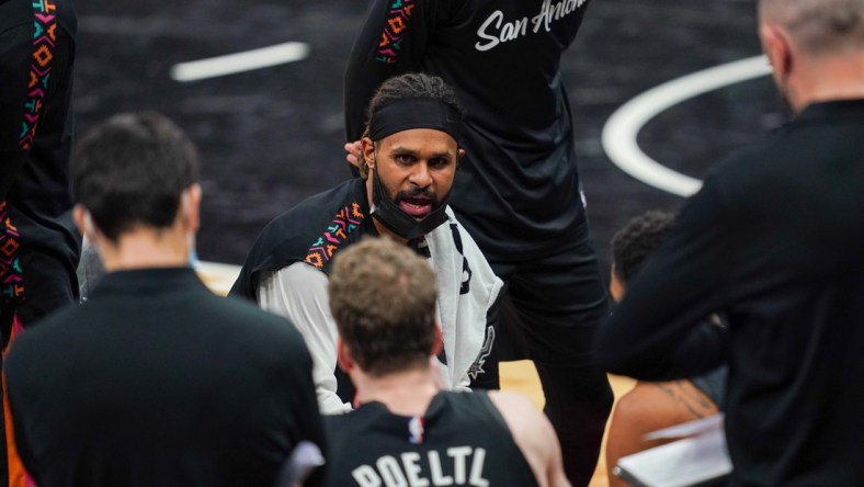 Jan 22, 2021; San Antonio, Texas, USA;  San Antonio Spurs guard Patty Mills (8) talks to his team during a timeout in the second half against the Dallas Mavericks at the AT&T Center. Mandatory Credit: Daniel Dunn-USA TODAY Sports