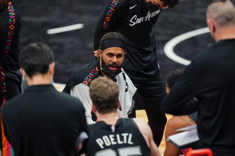 Jan 22, 2021; San Antonio, Texas, USA;  San Antonio Spurs guard Patty Mills (8) talks to his team during a timeout in the second half against the Dallas Mavericks at the AT&T Center. Mandatory Credit: Daniel Dunn-USA TODAY Sports