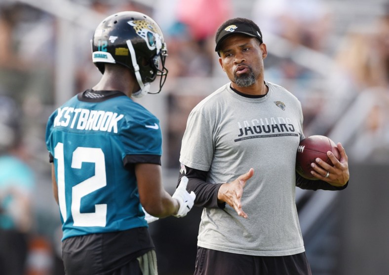 Jaguars #12, Dede Westbrook gets instructions from wide receivers coach Keenan McCardell during Tuesday morning's minicamp session. The Jacksonville Jaguars held their first day of 2019 mandatory minicamp at the practice fields by TIAA Bank Field Tuesday, June 11, 2019. [Bob Self/Florida Times-Union]

Fl Jax Jagsmandatoryminica 1