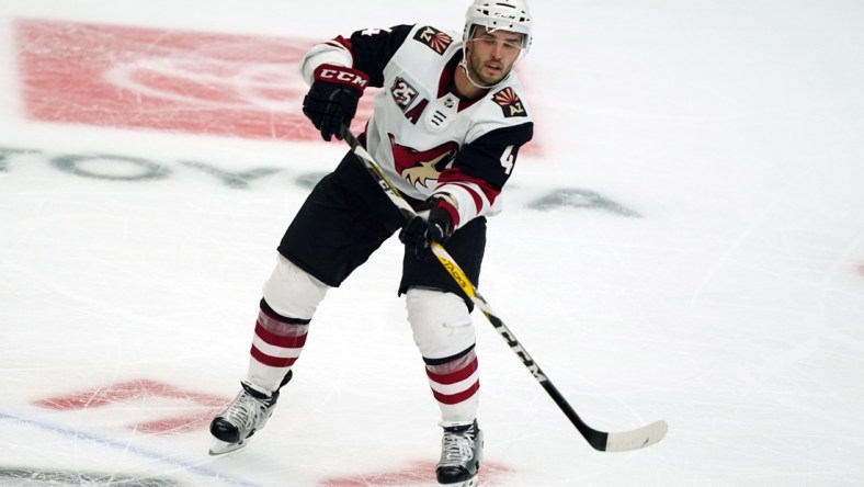 Mar 3, 2021; Los Angeles, California, USA; Arizona Coyotes defenseman Niklas Hjalmarsson (4) passes the puck against the LA Kings in the second period at Staples Center. Mandatory Credit: Kirby Lee-USA TODAY Sports