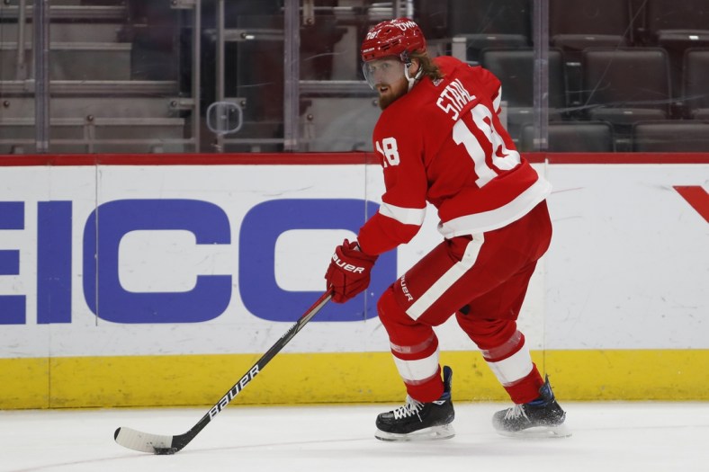 Mar 20, 2021; Detroit, Michigan, USA; Detroit Red Wings defenseman Marc Staal (18) looks for an open man during the first period against the Dallas Stars at Little Caesars Arena. Mandatory Credit: Raj Mehta-USA TODAY Sports