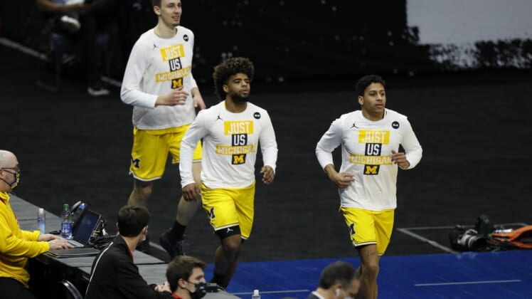 Mar 22, 2021; Indianapolis, Indiana, USA; Michigan Wolverines run onto the court before the game against the Louisiana State Tigers in the second round of the 2021 NCAA Tournament at Lucas Oil Stadium. Mandatory Credit: Joshua Bickel-USA TODAY Sports