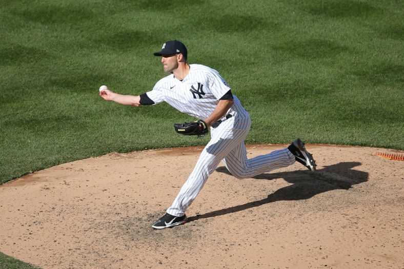 Apr 3, 2021; Bronx, New York, USA; New York Yankees relief pitcher Darren O'Day (56) pitches against the Toronto Blue Jays during the eighth inning at Yankee Stadium. Mandatory Credit: Brad Penner-USA TODAY Sports
