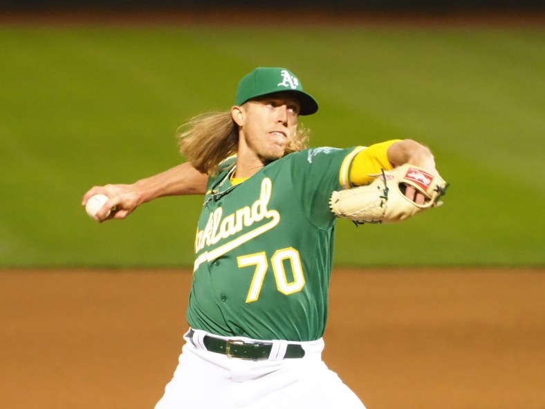 Apr 6, 2021; Oakland, California, USA; Oakland Athletics relief pitcher Jordan Weems (70) pitches the ball against the Los Angeles Dodgers during the ninth inning at RingCentral Coliseum. Mandatory Credit: Kelley L Cox-USA TODAY Sports