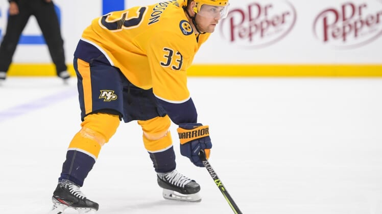 Apr 13, 2021; Nashville, Tennessee, USA;  Nashville Predators right wing Viktor Arvidsson (33) awaits the face off against the Tampa Bay Lightning during the first period at Bridgestone Arena. Mandatory Credit: Steve Roberts-USA TODAY Sports