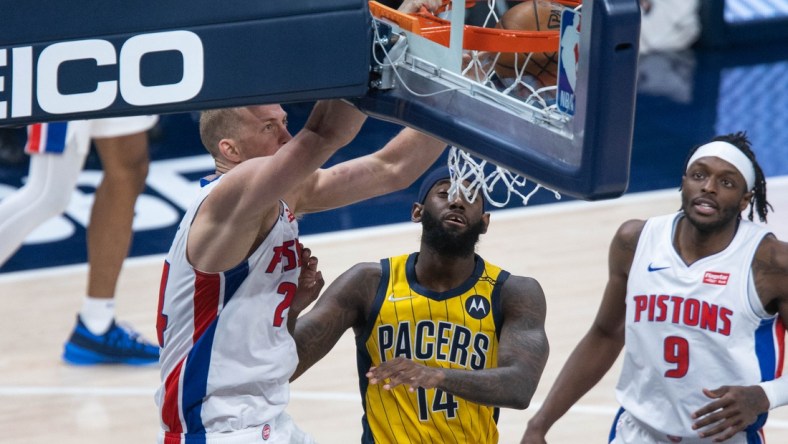 Apr 24, 2021; Indianapolis, Indiana, USA; Detroit Pistons center Mason Plumlee (24) dunks against Indiana Pacers forward JaKarr Sampson (14) in the third quarter at Bankers Life Fieldhouse. Mandatory Credit: Trevor Ruszkowski-USA TODAY Sports