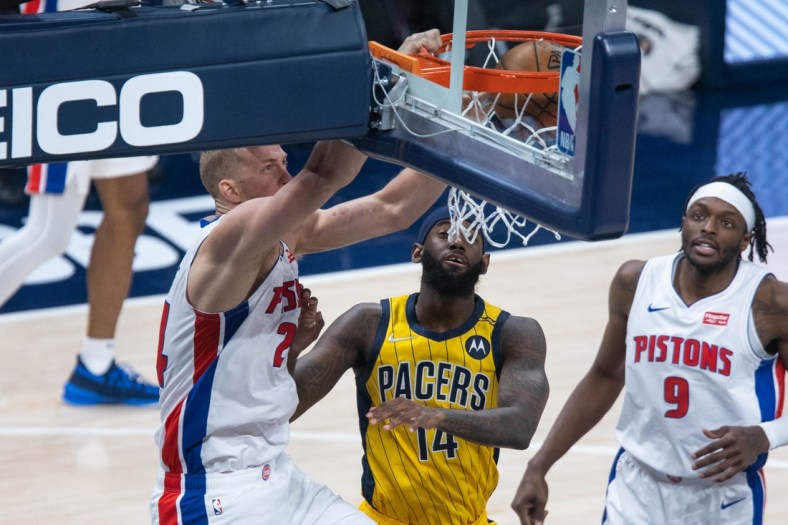 Apr 24, 2021; Indianapolis, Indiana, USA; Detroit Pistons center Mason Plumlee (24) dunks against Indiana Pacers forward JaKarr Sampson (14) in the third quarter at Bankers Life Fieldhouse. Mandatory Credit: Trevor Ruszkowski-USA TODAY Sports