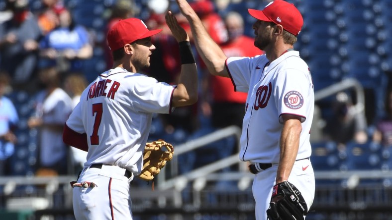 May 2, 2021; Washington, District of Columbia, USA; Washington Nationals starting pitcher Max Scherzer (31) is congratulated by shortstop Trea Turner (7) after the game against the Miami Marlins at Nationals Park. Mandatory Credit: Brad Mills-USA TODAY Sports