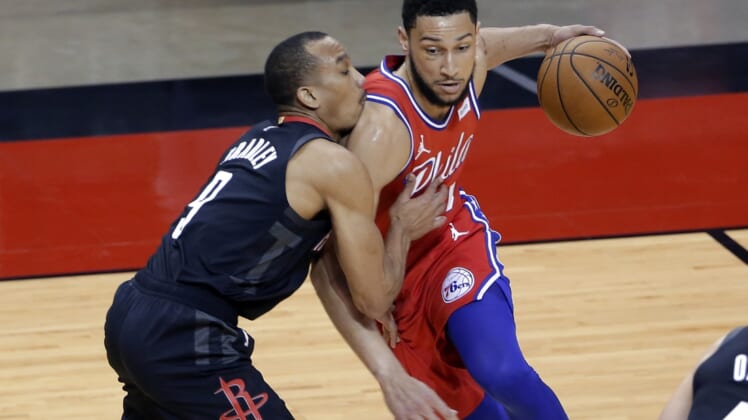 May 5, 2021; Houston, Texas, USA; Philadelphia 76ers guard Ben Simmons, right, drives into Houston Rockets guard Avery Bradley (9) during the first half at Toyota Center. Mandatory Credit:  Michael Wyke/POOL PHOTOS-USA TODAY Sports