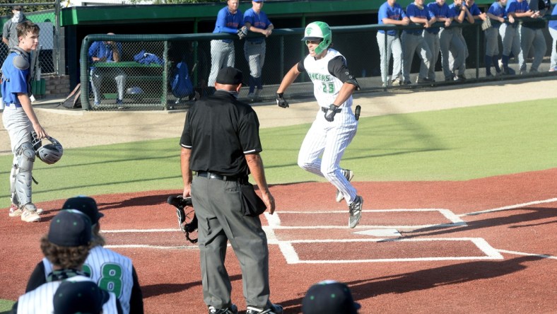 Thousand Oaks High's Max Muncy celebrates after touching home plate after hitting a game-tying home run in the bottom of the sixth inning against Westlake in a Marmonte League game on Wednesday, May 5, 2021. The Lancers won 10-8 to improve to 17-0 overall and 9-0 in league.

Thousand Oaks Westlake Baseball 3