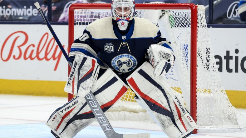 May 7, 2021; Columbus, Ohio, USA; Columbus Blue Jackets goaltender Matiss Kivlenieks (80) defends the net against the Detroit Red Wings in the second period at Nationwide Arena. Mandatory Credit: Aaron Doster-USA TODAY Sports