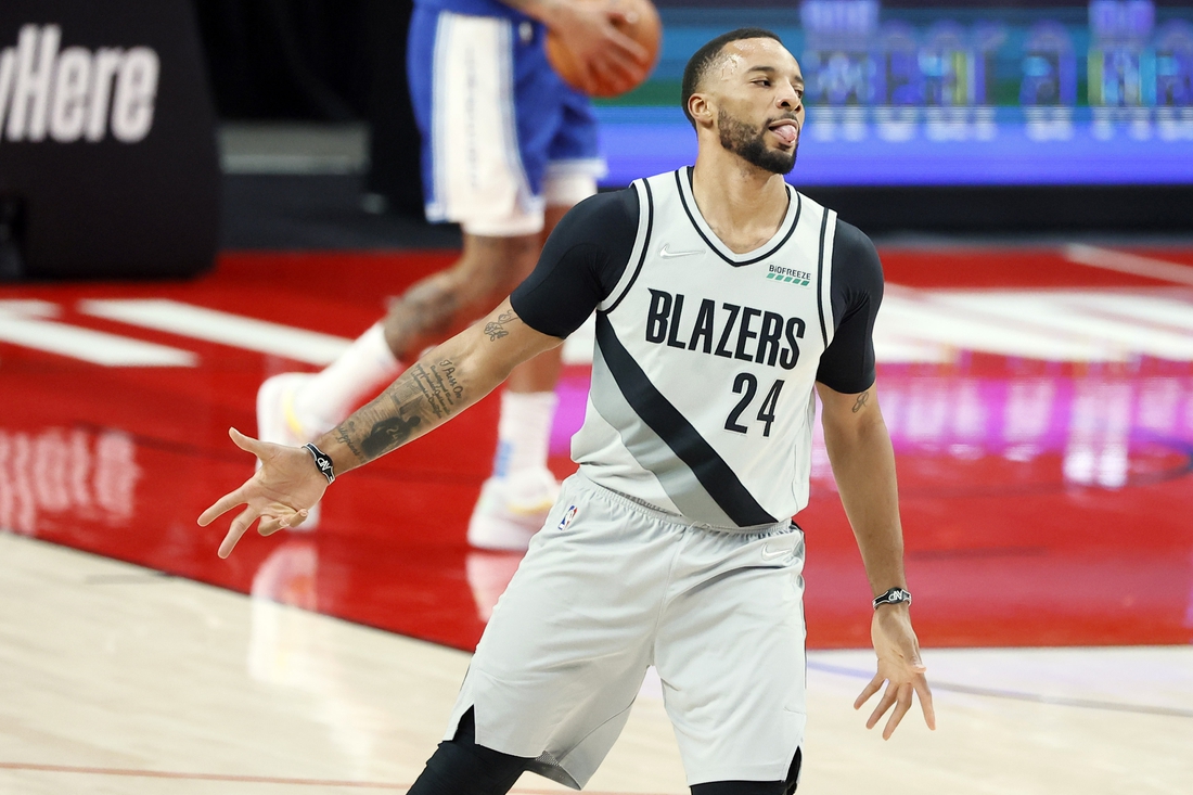 May 7, 2021; Portland, Oregon, USA; Portland Trail Blazers small forward Norman Powell (24) reacts after a three-point basket during the first half against the Los Angeles Lakers at Moda Center. Mandatory Credit: Soobum Im-USA TODAY Sports