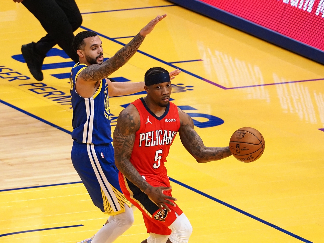 May 14, 2021; San Francisco, California, USA; New Orleans Pelicans guard Eric Bledsoe (5) looks to pass the ball against Golden State Warriors guard Mychal Mulder (15) during the second quarter at Chase Center. Mandatory Credit: Kelley L Cox-USA TODAY Sports