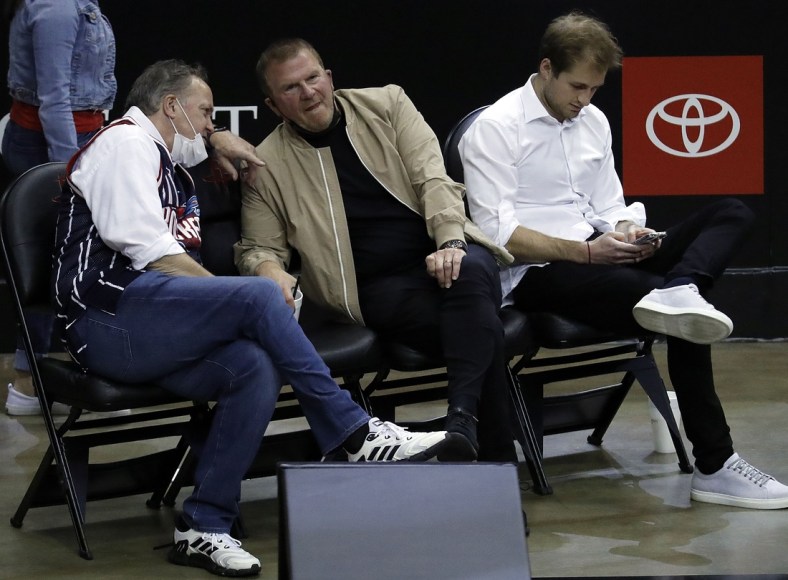 May 14, 2021; Houston, Texas, USA; Houston Rockets owner Tilman Fertitta (center) and team president Tad Brown (left) and Patrick Fertitta (right) sit court-side as the Houston Rockets play the LA Clippers at Toyota Center. Mandatory Credit:  Bob Levey/Pool Photo-USA TODAY Sports
