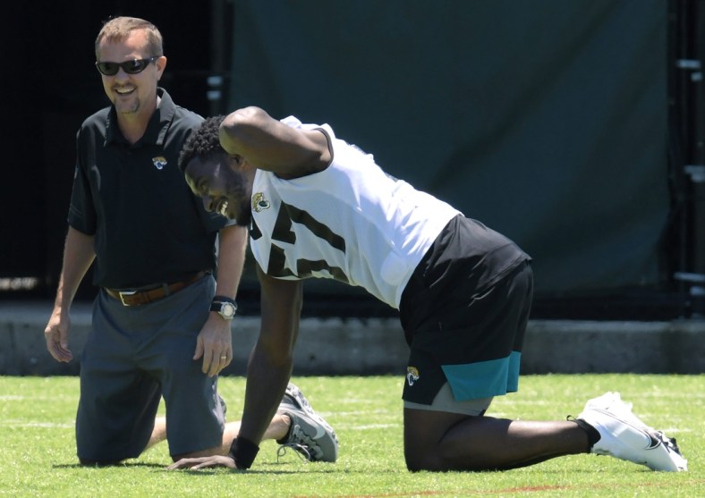 Jaguars line backer #57, Dylan Moses goes through stretching drills during Saturday's Rookie Minicamp session. The Jacksonville Jaguars held their Saturday 2021 Rookie Minicamp session at the practice fields outside TIAA Bank Field Saturday, May 15, 2021.

Jki 051521 Jaguarsrookiecamp 22