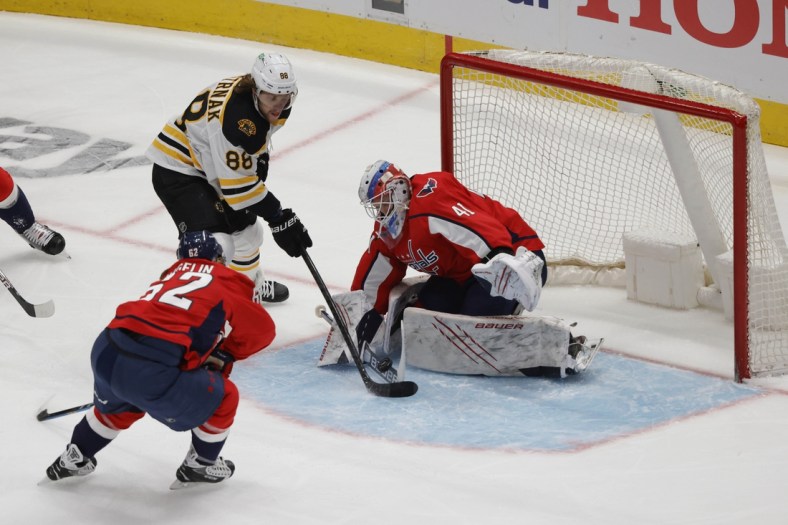 May 15, 2021; Washington, District of Columbia, USA; Washington Capitals goaltender Vitek Vanecek (41) makes a save on Boston Bruins right wing David Pastrnak (88) in the first period in game one of the first round of the 2021 Stanley Cup Playoffs at Capital One Arena. Mandatory Credit: Geoff Burke-USA TODAY Sports