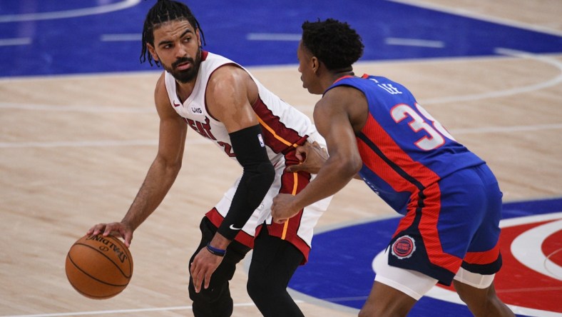 May 16, 2021; Detroit, Michigan, USA; Miami Heat guard Gabe Vincent (2) drives to the basket as Detroit Pistons guard Saben Lee (38) defends during the fourth quarter at Little Caesars Arena. Mandatory Credit: Tim Fuller-USA TODAY Sports