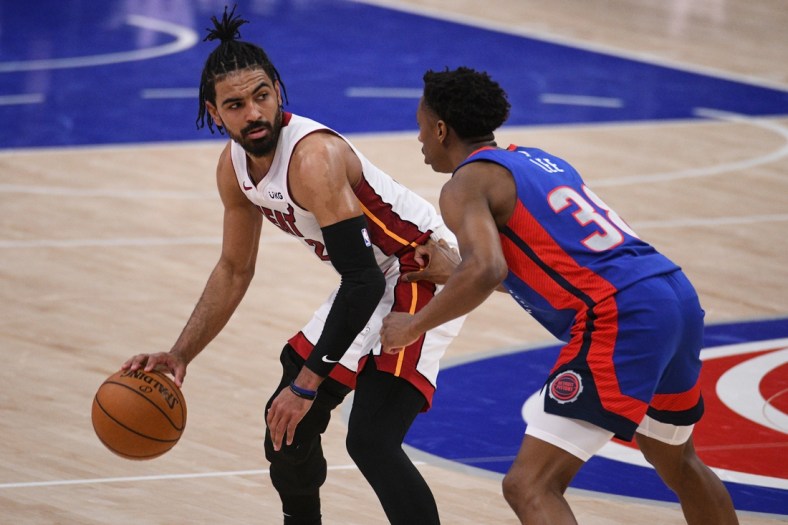 May 16, 2021; Detroit, Michigan, USA; Miami Heat guard Gabe Vincent (2) drives to the basket as Detroit Pistons guard Saben Lee (38) defends during the fourth quarter at Little Caesars Arena. Mandatory Credit: Tim Fuller-USA TODAY Sports