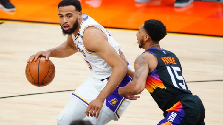 May 23, 2021; Phoenix, Arizona, USA; Los Angeles Lakers guard Talen Horton-Tucker (5) against Phoenix Suns guard Cameron Payne (15) during game one in the first round of the 2021 NBA Playoffs. at Phoenix Suns Arena. Mandatory Credit: Mark J. Rebilas-USA TODAY Sports