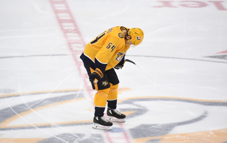 May 27, 2021; Nashville, Tennessee, USA; Nashville Predators center Mikael Granlund (64) reacts after an overtime loss against the Carolina Hurricanes in game six of the first round of the 2021 Stanley Cup Playoffs at Bridgestone Arena. Mandatory Credit: Christopher Hanewinckel-USA TODAY Sports