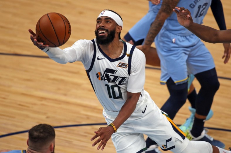 May 29, 2021; Memphis, Tennessee, USA; Utah Jazz guard Mike Conley (10) drives to the basket during the fourth quarter during game three in the first round of the 2021 NBA Playoffs against the Memphis Grizzlies at FedExForum. Mandatory Credit: Petre Thomas-USA TODAY Sports