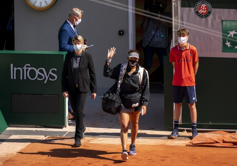 May 30, 2021; Paris, France; Naomi Osaka (JPN) enters the court for her match against Patricia Maria Tig (ROU) at Roland Garros Stadium. Mandatory Credit: Susan Mullane-USA TODAY Sports