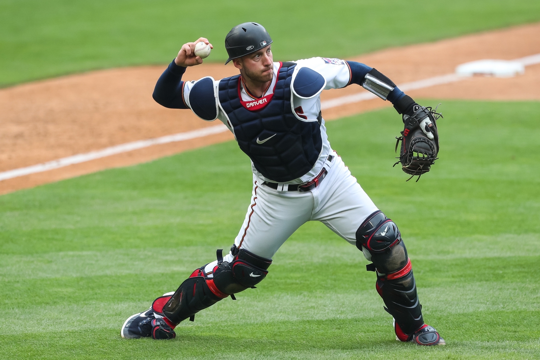 May 30, 2021; Minneapolis, Minnesota, USA; Minnesota Twins catcher Mitch Garver (8) throws the ball to first base against the Kansas City Royals in the ninth inning at Target Field. Mandatory Credit: David Berding-USA TODAY Sports