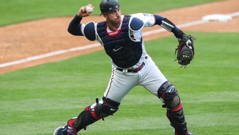 May 30, 2021; Minneapolis, Minnesota, USA; Minnesota Twins catcher Mitch Garver (8) throws the ball to first base against the Kansas City Royals in the ninth inning at Target Field. Mandatory Credit: David Berding-USA TODAY Sports